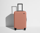 The Bigger Carry-On in Clay Pink